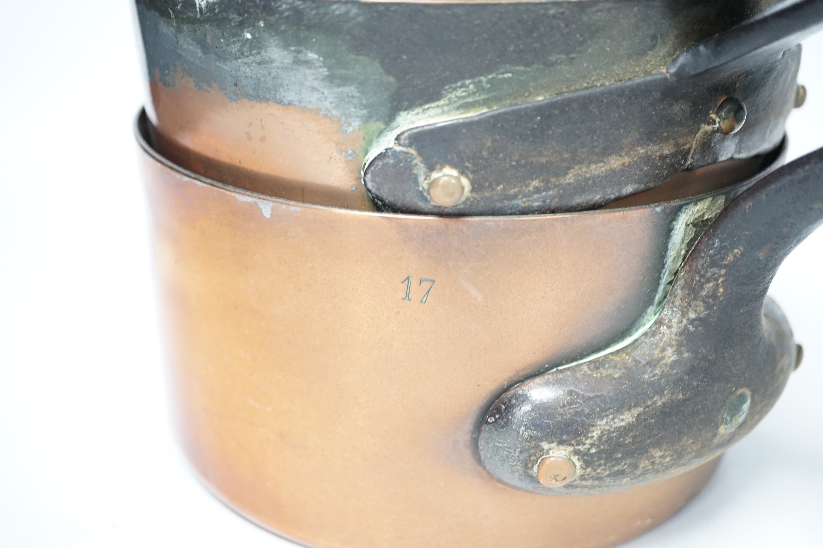 A set of six graduated copper saucepans